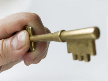 Close-up of human hand against white background