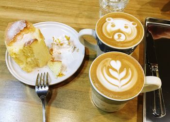 High angle view of cappuccino served on table