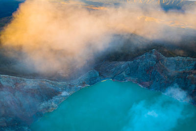 High angle view of hot spring amidst mountains
