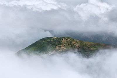 Scenic view of mountains in foggy weather