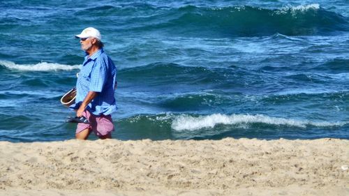 Woman standing on beach