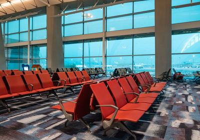 Empty chairs and tables in airport