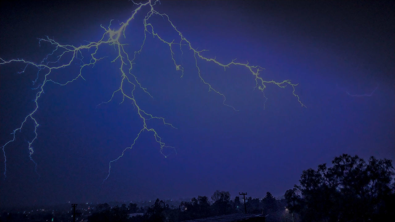 LOW ANGLE VIEW OF LIGHTNING AT NIGHT