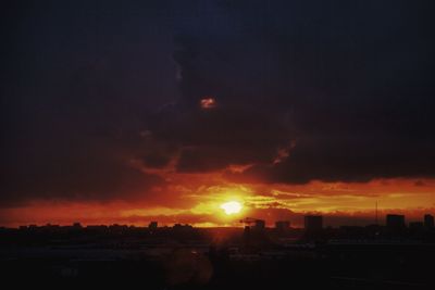 Scenic view of sunset over city