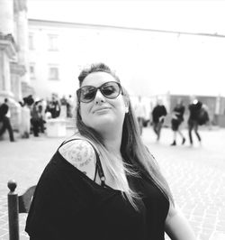 Portrait of young woman wearing sunglasses