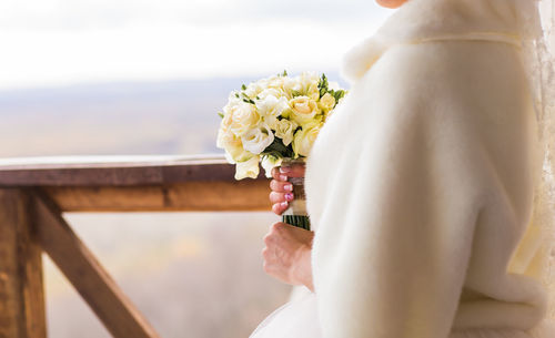 Close-up of white flower holding bouquet