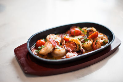 Close-up of shrimp tomato tapas dish