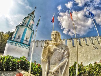 Low angle view of statue against cloudy sky