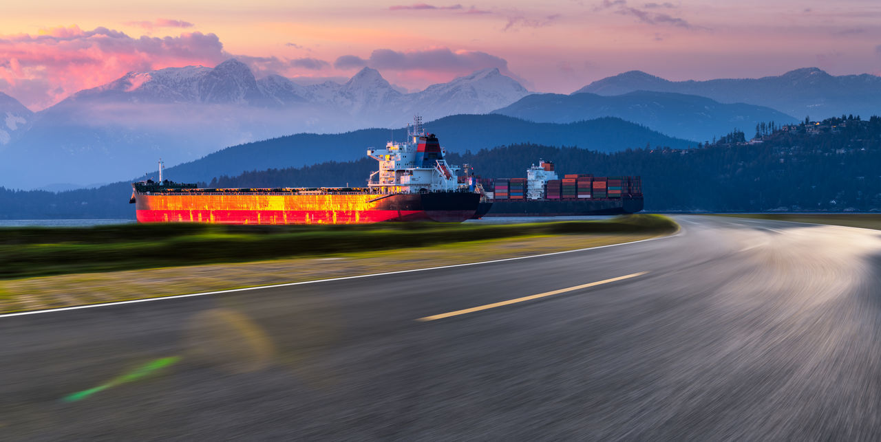 SCENIC VIEW OF ROAD AGAINST SKY DURING SUNSET