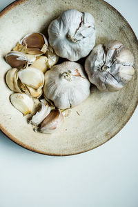 High angle view of garlic on white background