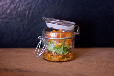 Close-up of drink in glass jar on table