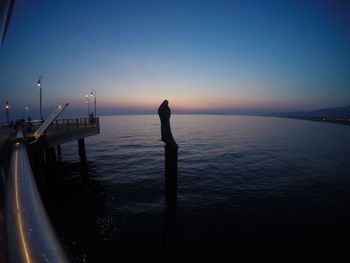 Scenic view of sea against sky at sunset