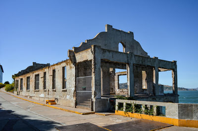 Old ruin building against blue sky