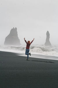 Lady on basalt northern beach scenic photography