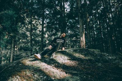 Shadow of man on tree in forest