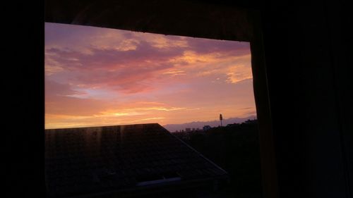 Silhouette of building at sunset