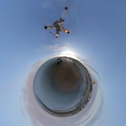 Low angle view of airplane flying in sky
