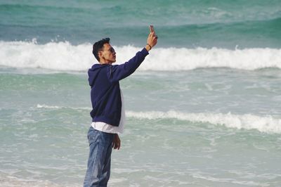 Full length of man standing at beach