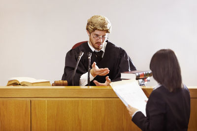 Judge sitting in courtroom