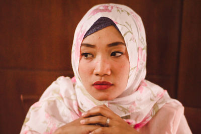 Close-up of tensed thoughtful young woman wearing hijab