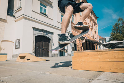 Low angle view of man skateboarding on street