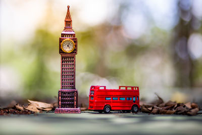 Close-up of toy car against building