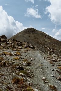 Low angle view of rocky mountain against sky