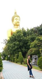 Statue of buddha against clear sky