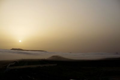 Scenic view of landscape against sky during sunset