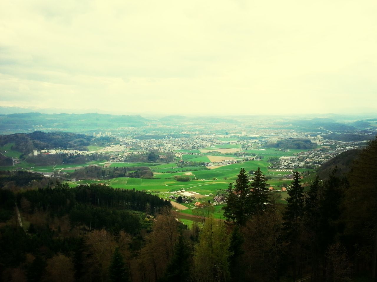 landscape, tranquil scene, tranquility, sky, scenics, tree, beauty in nature, mountain, nature, green color, field, cloud - sky, growth, rural scene, high angle view, non-urban scene, cloudy, idyllic, hill, cloud