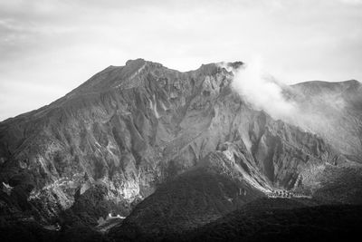 Scenic view of volcanic mountain against sky