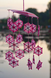 Close-up of paper decoration hanging outdoors