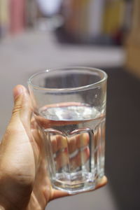 Close-up of hand holding drink