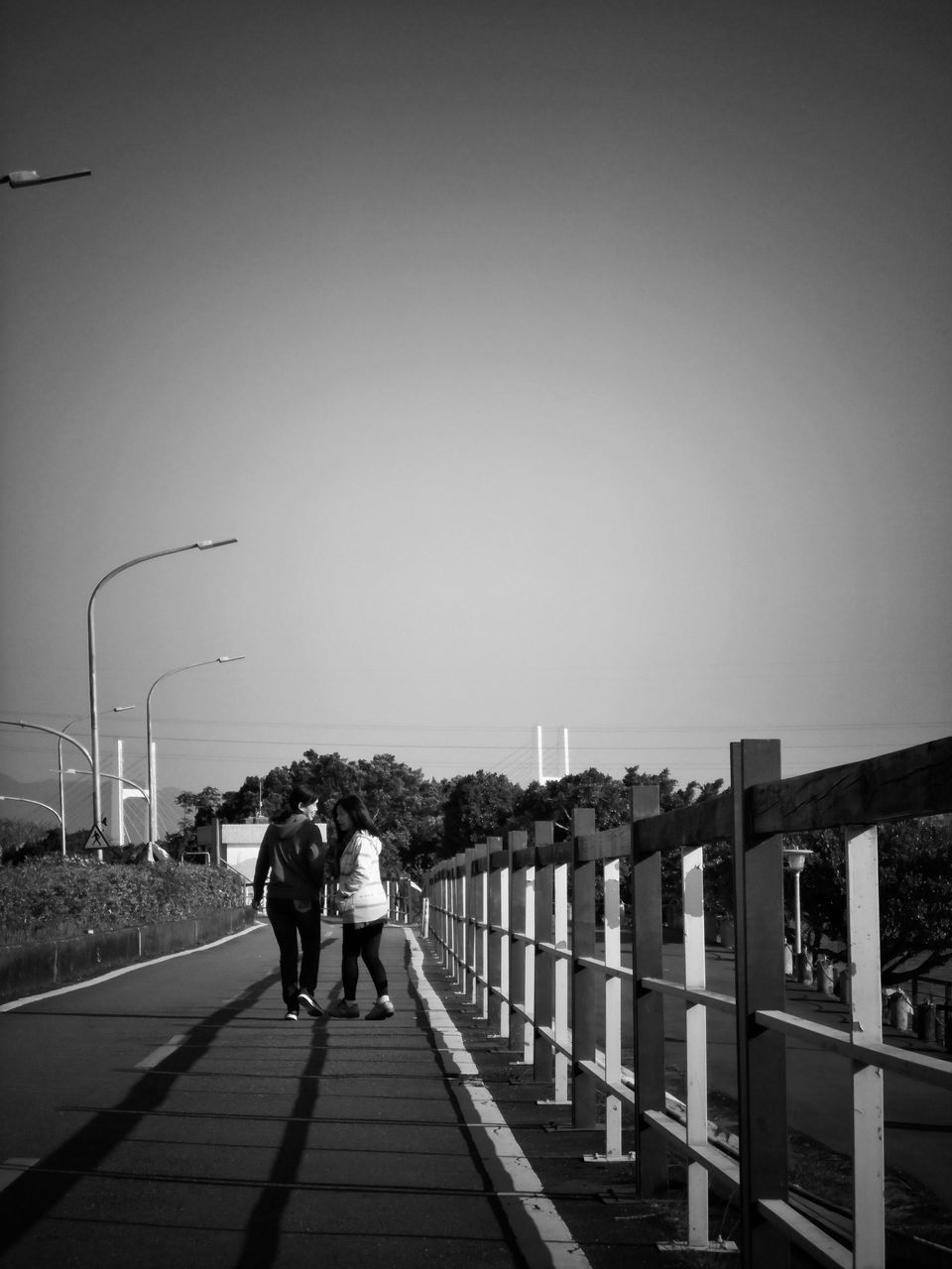 real people, sky, two people, clear sky, lifestyles, nature, copy space, women, leisure activity, togetherness, men, the way forward, full length, railing, rear view, people, adult, direction, day, built structure, outdoors, positive emotion, couple - relationship