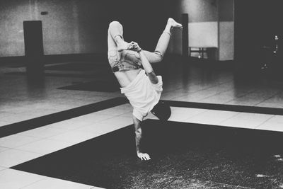 Low section of woman walking on floor