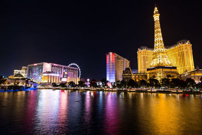 Illuminated buildings at waterfront