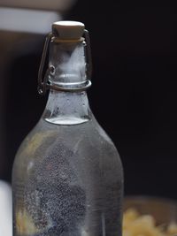 Close-up of glass bottle on table