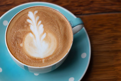 High angle view of cappuccino on table