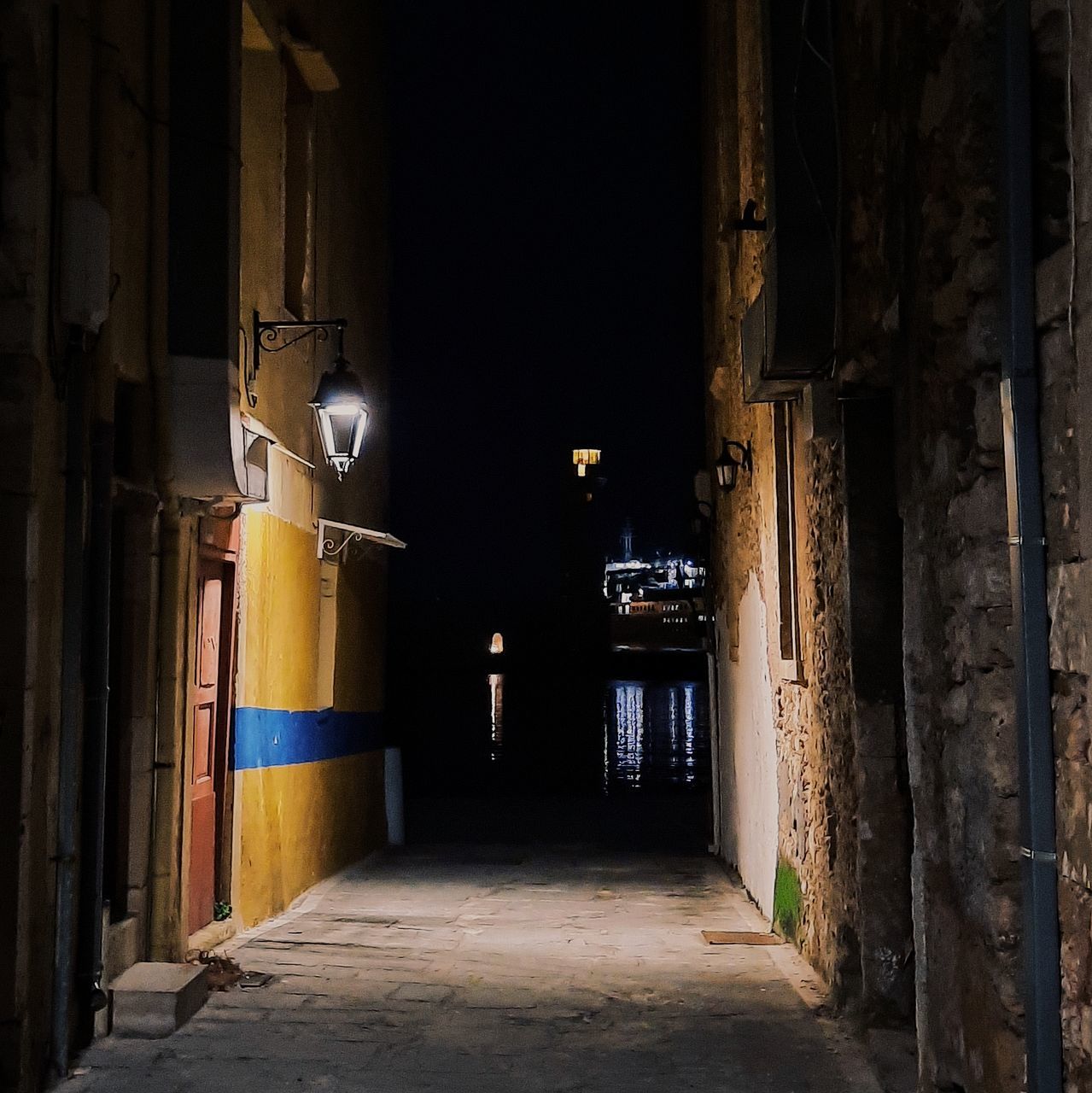 alley, architecture, road, street, darkness, urban area, night, infrastructure, built structure, building, light, no people, the way forward, building exterior, history, city, ancient history, old, the past, lighting, lighting equipment, outdoors