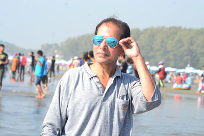 Portrait of man standing on water