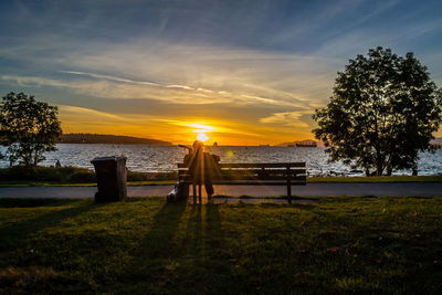 Scenic view of lake at sunset