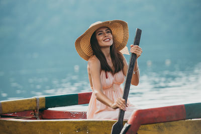 Woman in outrigger in lake