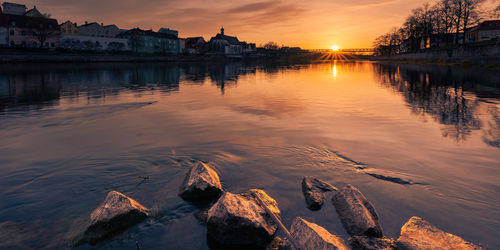 Scenic view of lake against sky during sunset