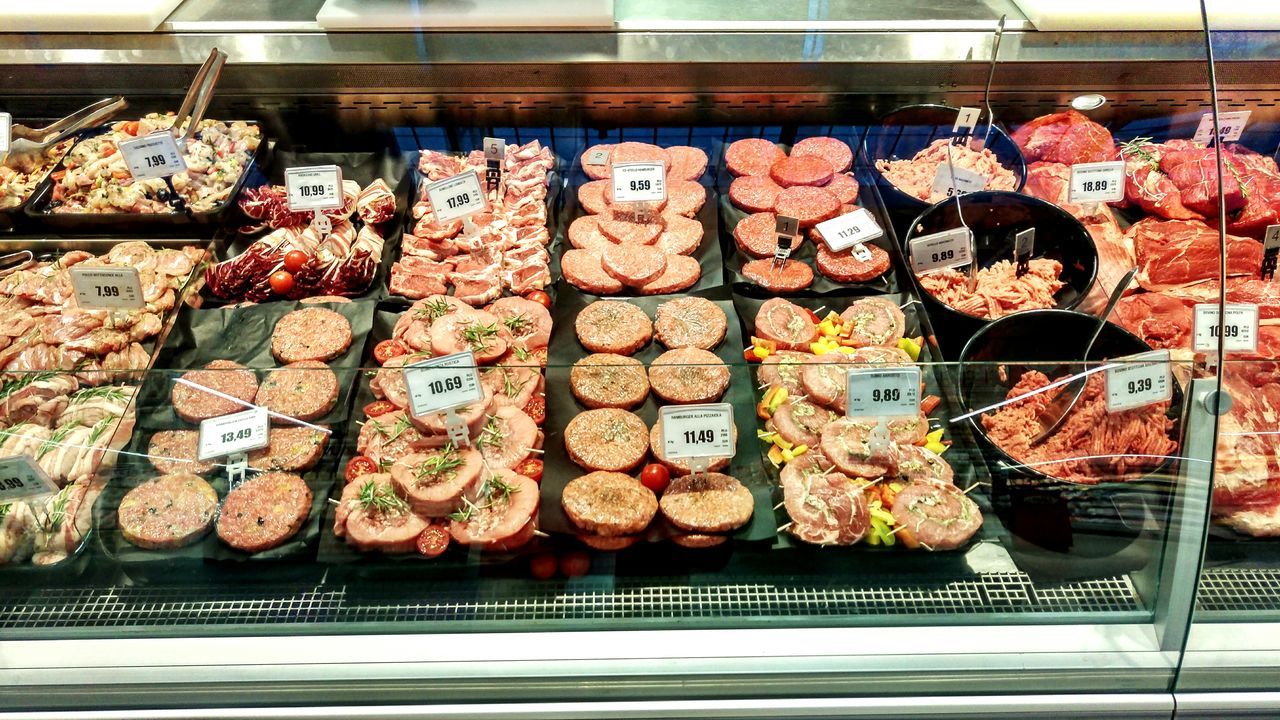 VARIETY OF FOOD FOR SALE AT MARKET STALL