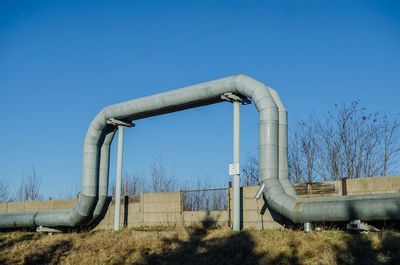 Scenic view of agricultural field against clear blue sky