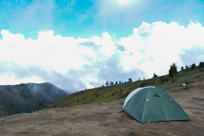 Tent on land against sky