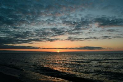 Scenic view of sea against dramatic sky