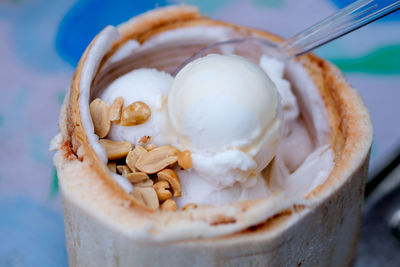 Close-up of ice cream served in coconut shell