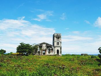 Church on field against sky