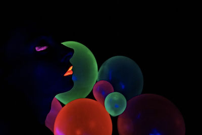 Close-up of multi colored lights against black background